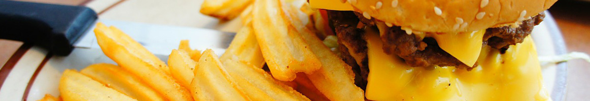 Eating American (Traditional) Burger at Kincaid's Hamburgers restaurant in Fort Worth, TX.
